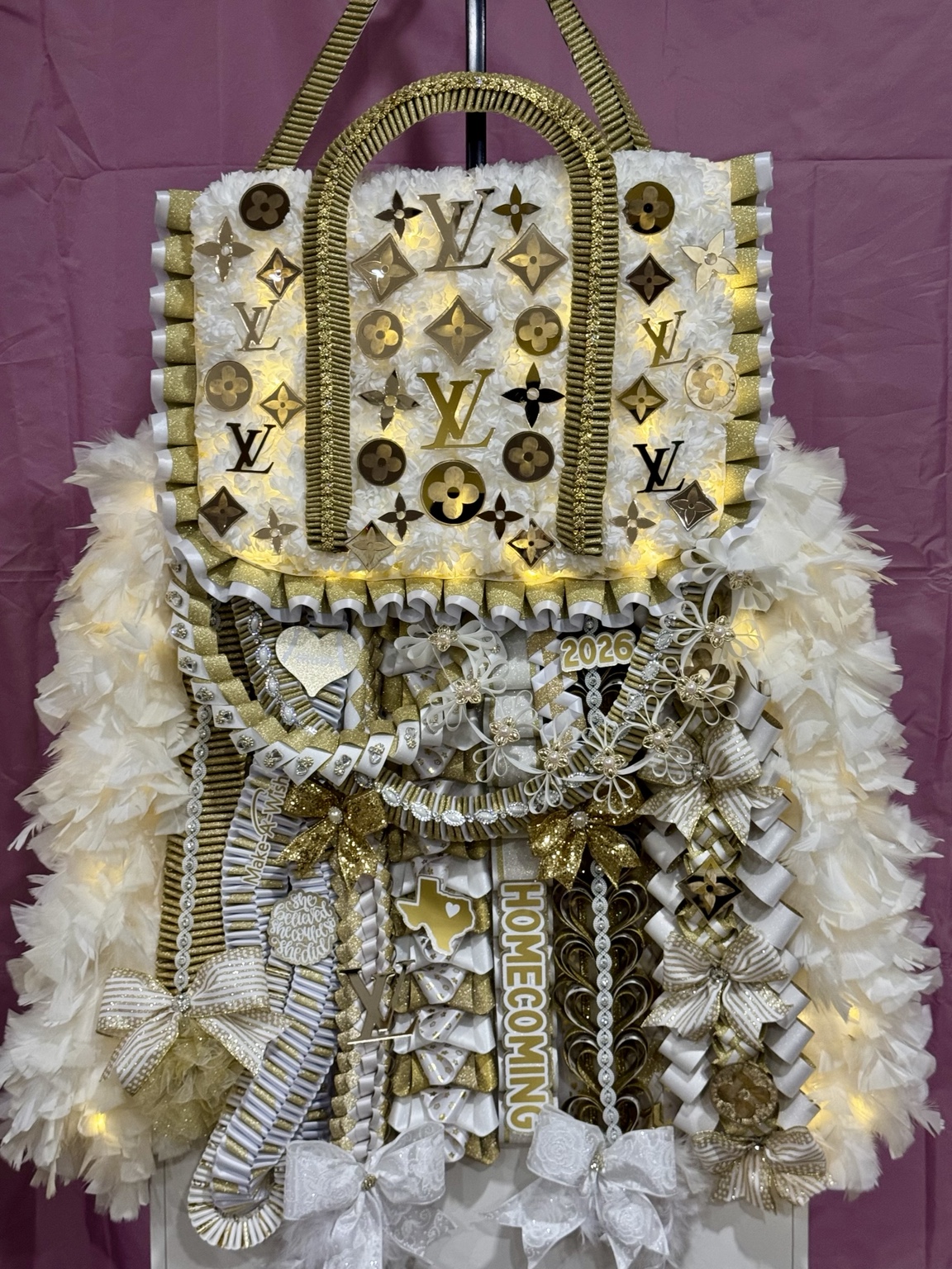 Louis Vuitton-inspired Make-A-Wish fundraiser homecoming mum